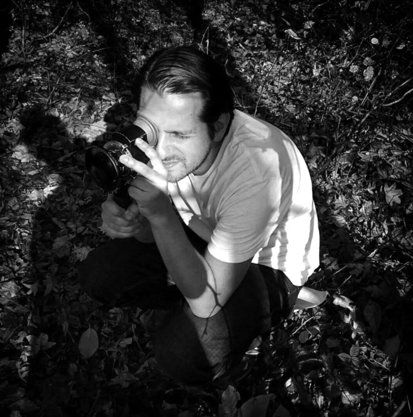 Rich with a director's finder in the woods